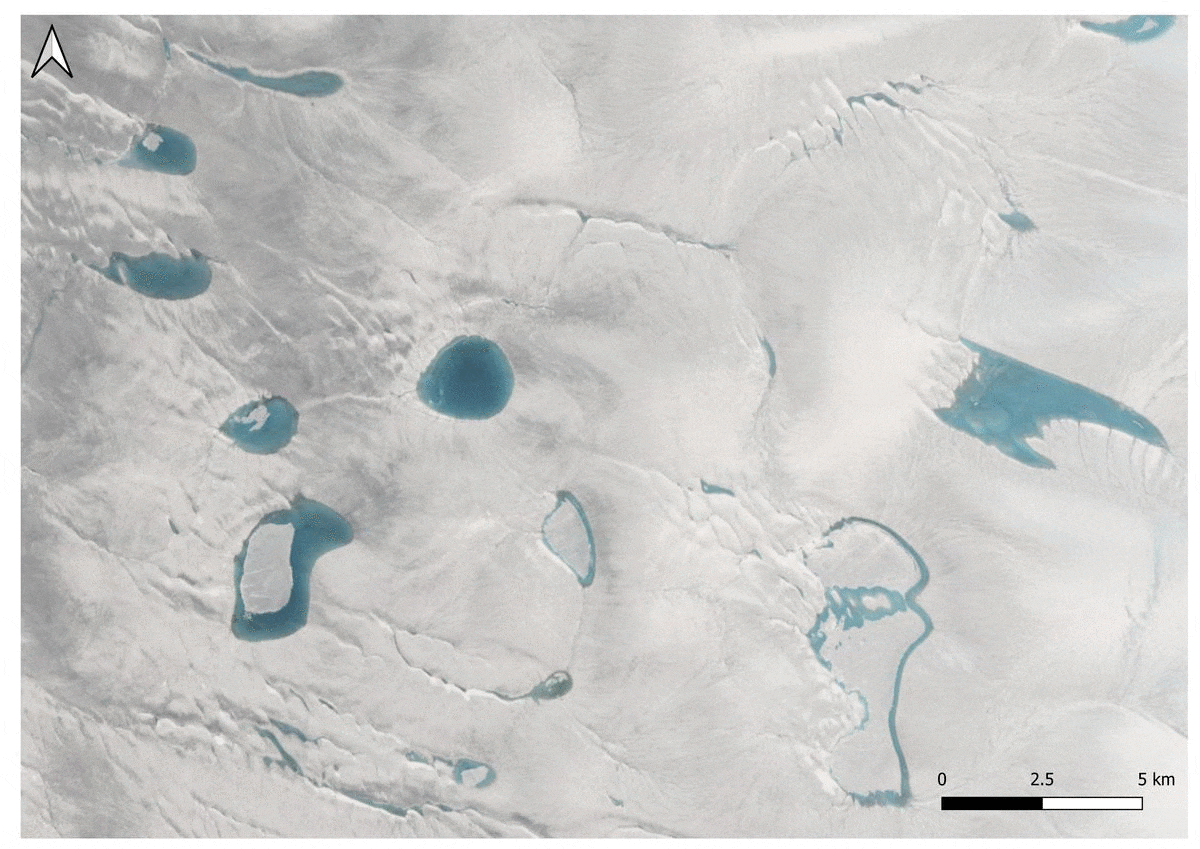 A aerial view of a snowy landscape

Description automatically generated