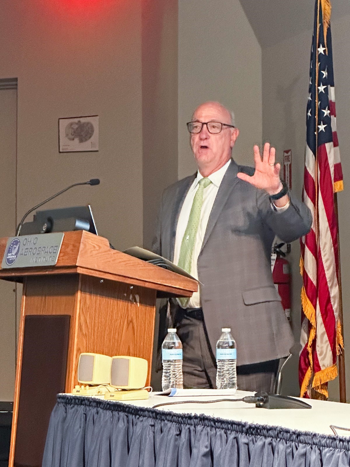 Col. (ret) Joseph Zeis, Jr., senior advisor for Aerospace and Defense to Gov. Mike DeWine speaks at a podium