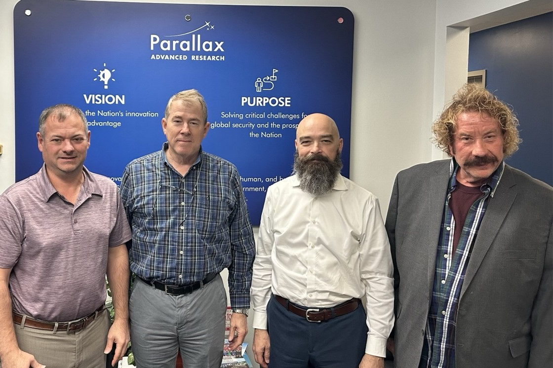 Photo caption: Parallax Advanced Research and Southwest Research Institute (SwRI) EW Team; left to right: Mr. Justin S. Tieman, Principal Engineer, SwRI; Mr. Keith G. Dufford, Senior Program Manager, SwRI; Mr. David A. Brown, Institute Engineer; and Director AI Hardware Research and Neuromorphic Center of Excellence, Parallax; Dr. Steven D. Harbour
