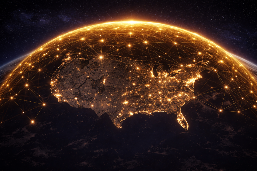 AI-generated illustration of a gold digital connectivity dome over the continental United States (generated with DALL·E via ChatGPT, Jan. 14, 2026)